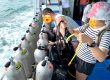 Divers preparing equipment on the boat before starting their Phuket dive trip